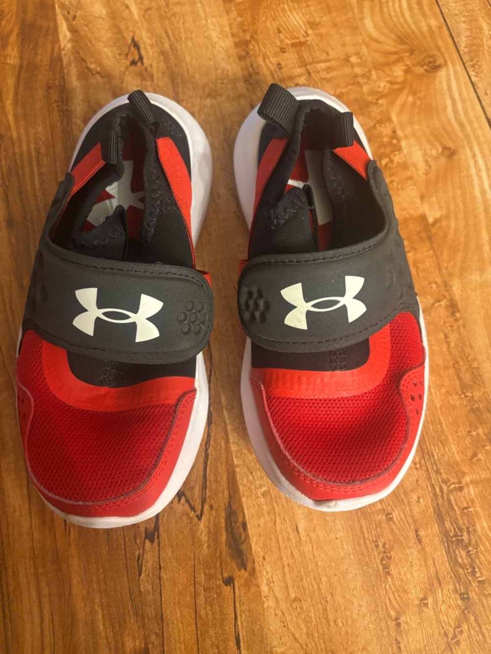 Under Armour Kids Red and Black Slip-On Athletic Sneakers with White Soles